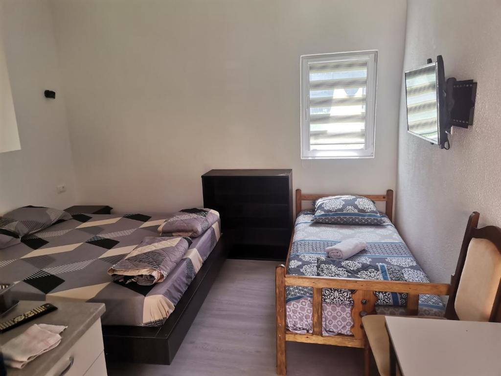 Postel nebo postele na pokoji v ubytování Ilce apartments