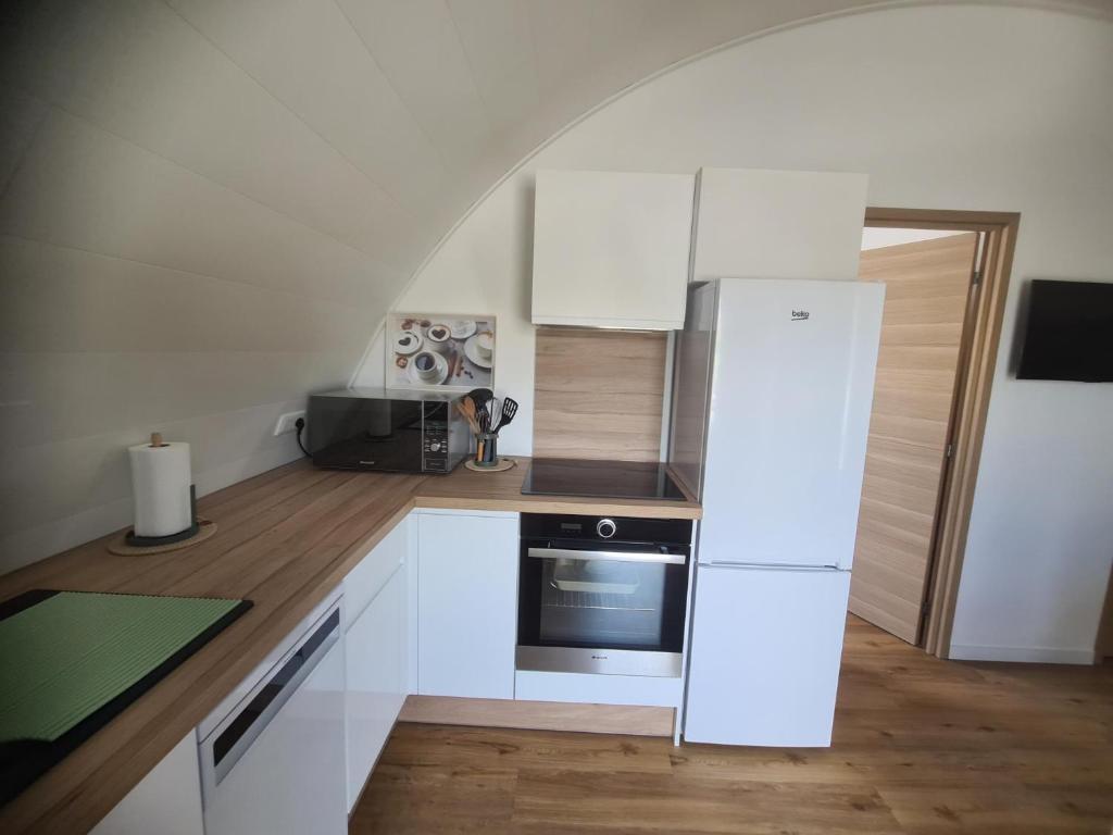 Kuchyň nebo kuchyňský kout v ubytování Au Jardin d'Edel Gîtes Centre Alsace
