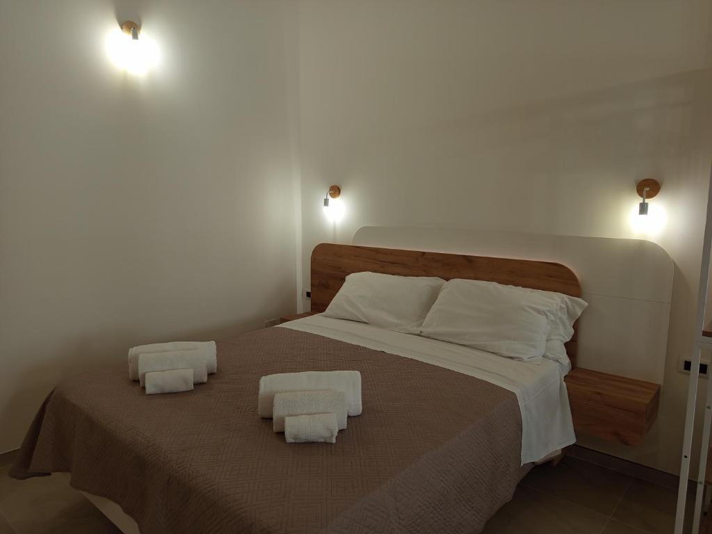 Łóżko lub łóżka w pokoju w obiekcie Casa A&F