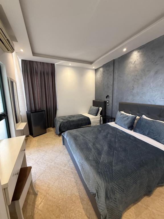 Postel nebo postele na pokoji v ubytování Hotel Riviera