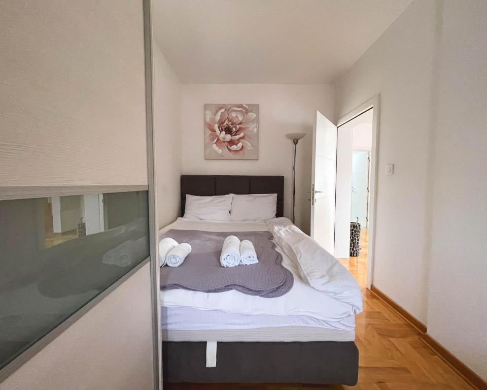 Postel nebo postele na pokoji v ubytování Apartmani TEO