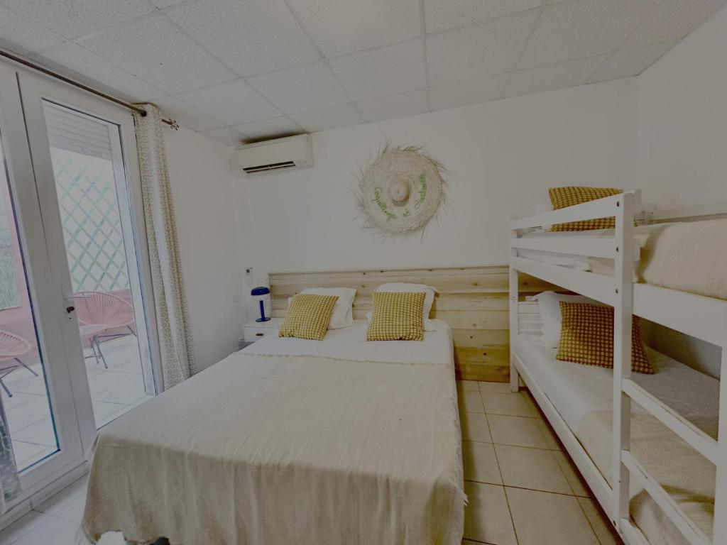 Postel nebo postele na pokoji v ubytování Hotel Camille