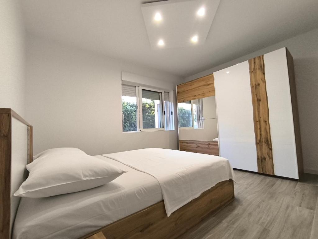 Postel nebo postele na pokoji v ubytování Apartments Villa Tanja