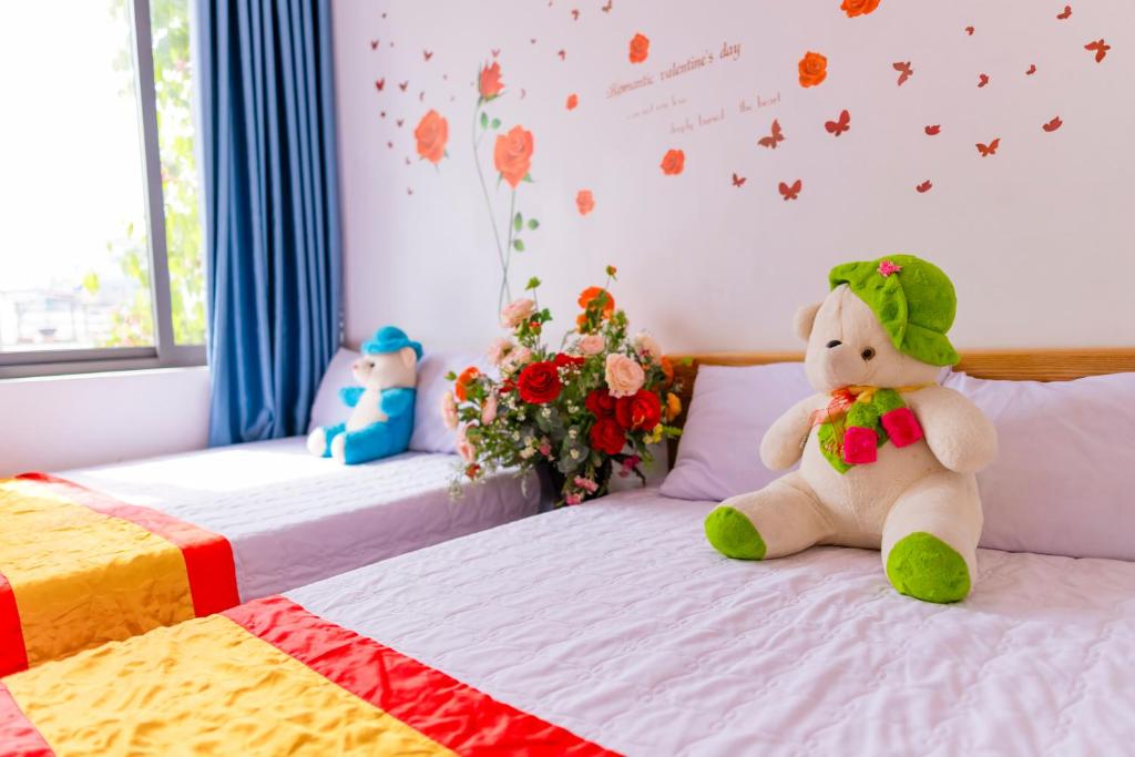 Postel nebo postele na pokoji v ubytování Đức Dũng Hotel