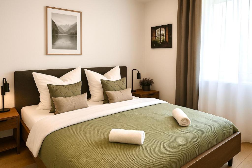 a bedroom with a large bed with a pillow on it at Wohnung in Siegen in Wilnsdorf