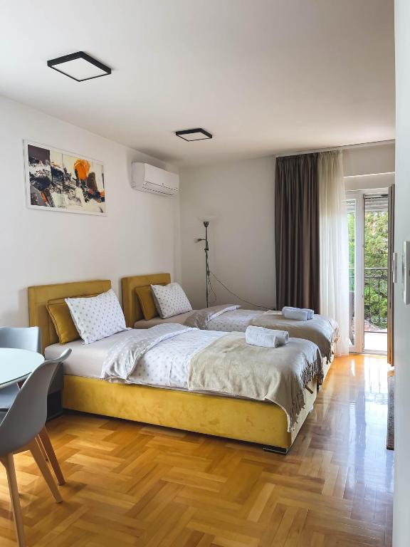 Postel nebo postele na pokoji v ubytování Apartmani TEO