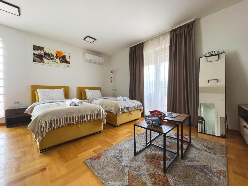 Postel nebo postele na pokoji v ubytování Apartmani TEO