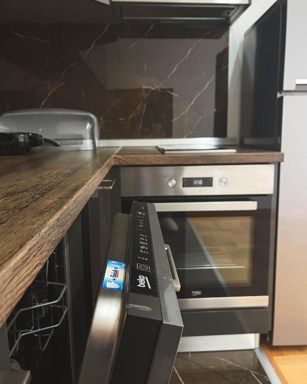 Kuchyň nebo kuchyňský kout v ubytování Apartmani TEO