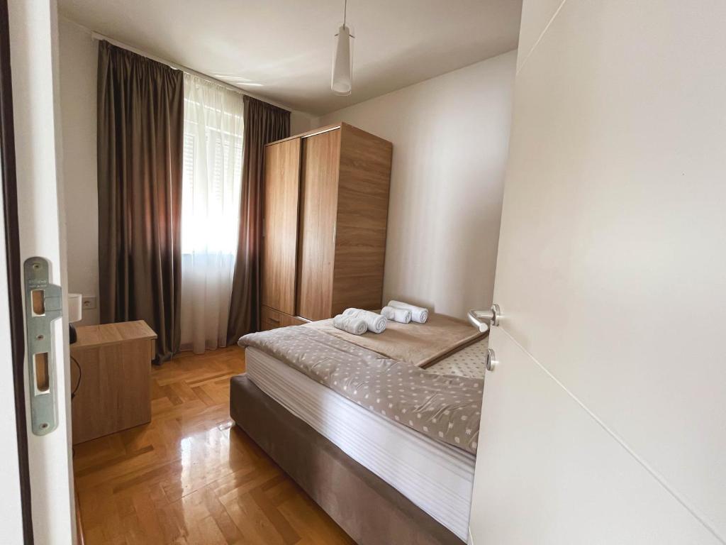 Postel nebo postele na pokoji v ubytování Apartmani TEO