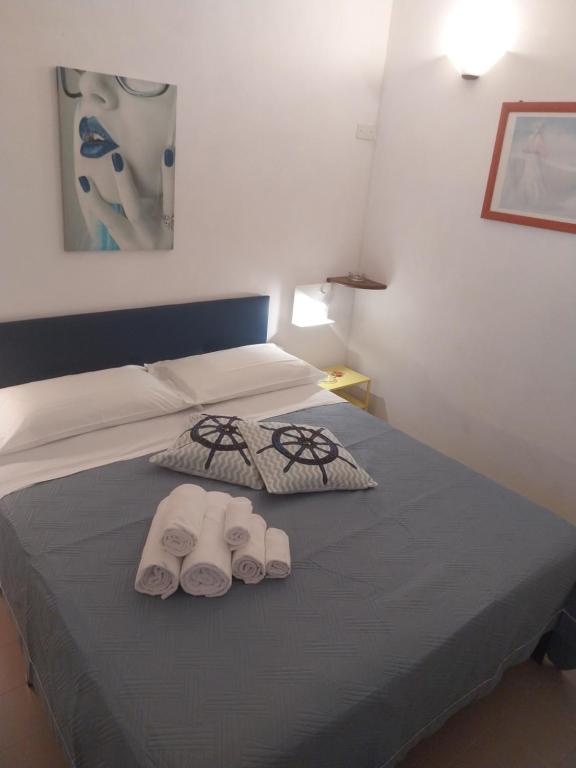 Posteľ alebo postele v izbe v ubytovaní Le Rocce Holiday Rooms