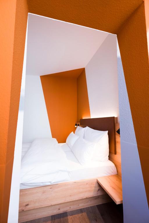 Postel nebo postele na pokoji v ubytování Hotel Sandkorn