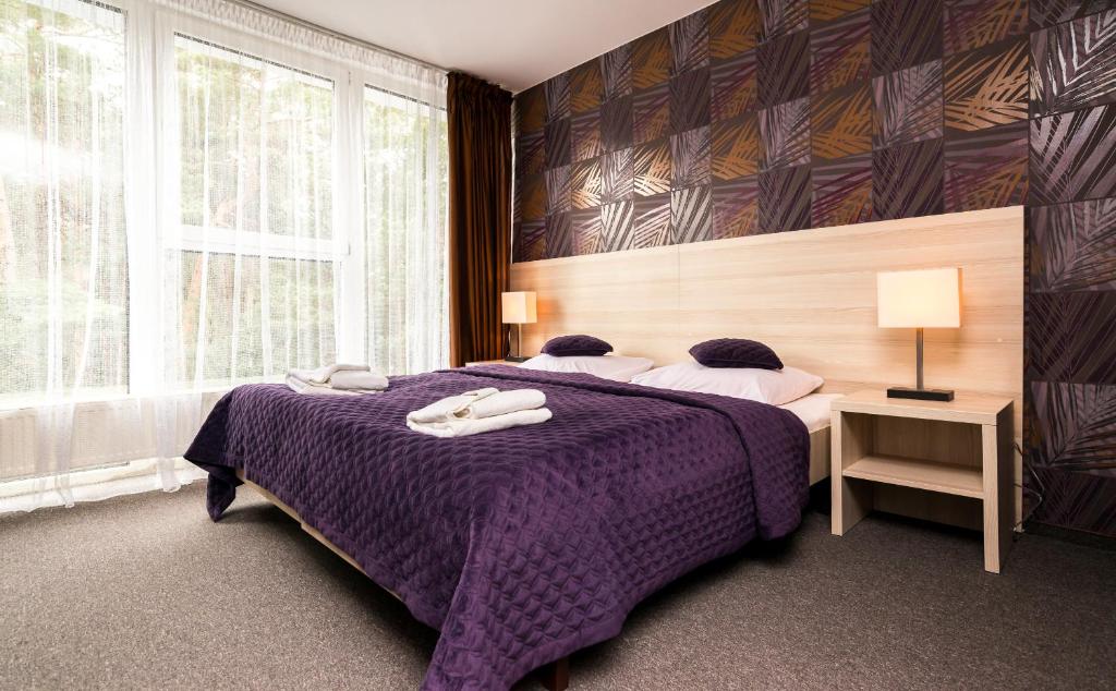 Łóżko lub łóżka w pokoju w obiekcie Baltic Inn