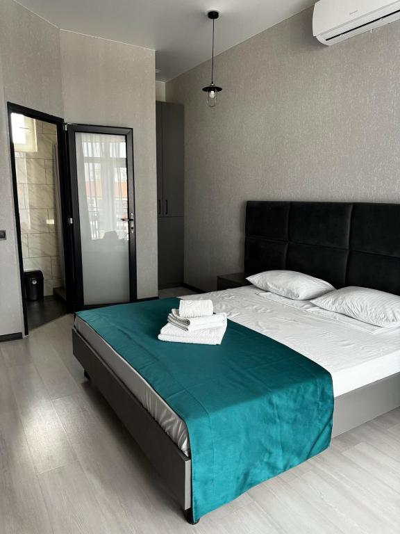 Postel nebo postele na pokoji v ubytování VIP HOTEL ZATOKA