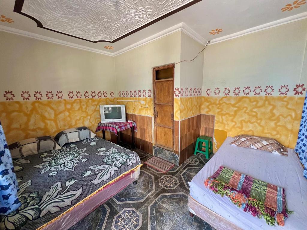 Postel nebo postele na pokoji v ubytování Hotel Henderson