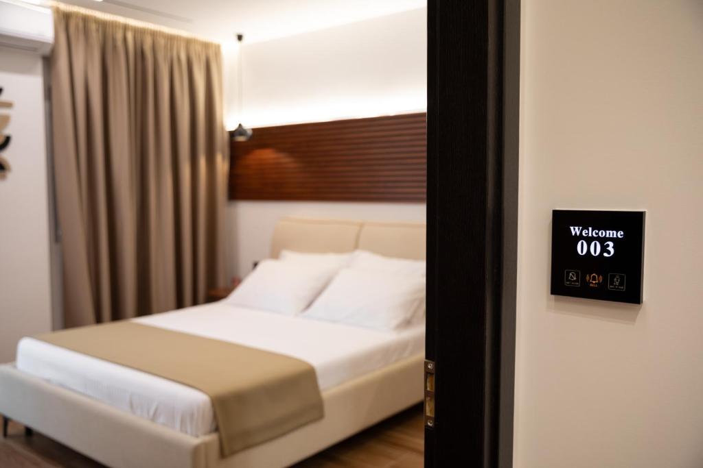 Postel nebo postele na pokoji v ubytování Silis Suite