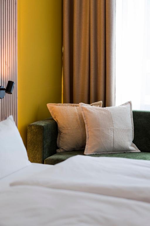 Postel nebo postele na pokoji v ubytování Hotel Sandkorn