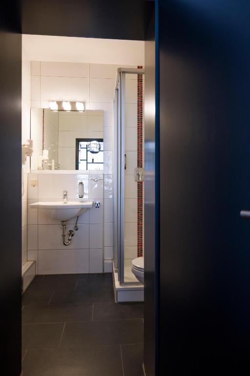 Koupelna v ubytování Hotel Sandkorn