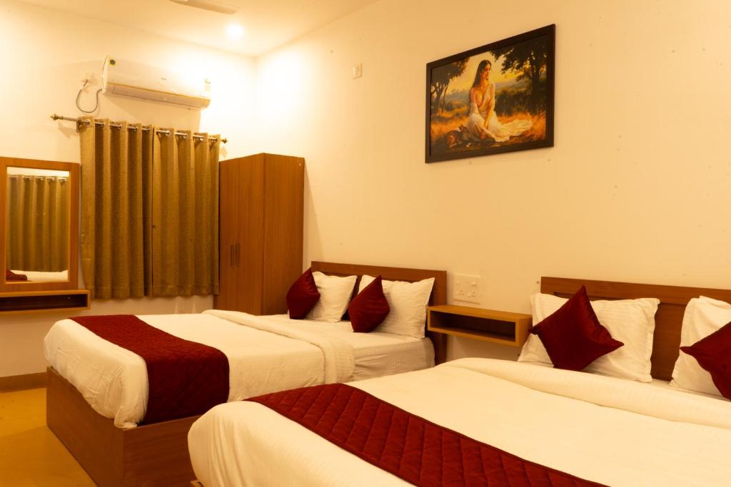 Postel nebo postele na pokoji v ubytování De Asian Resort Pondicherry