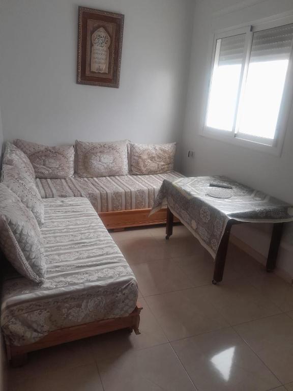 Voodi või voodid majutusasutuse Alhoceima Appartement Loft toas
