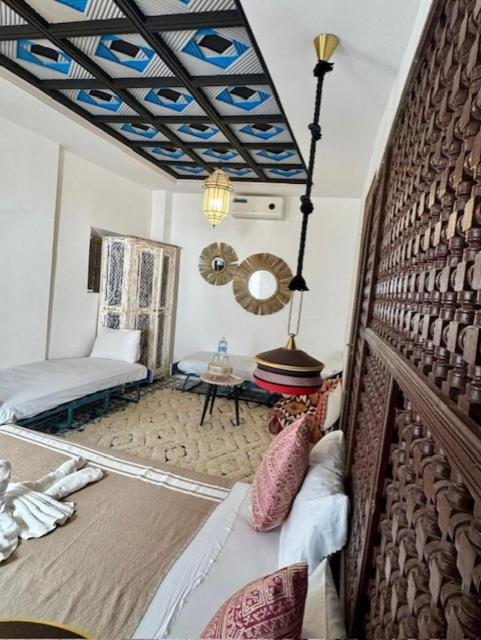Postel nebo postele na pokoji v ubytování Riad dar darcom
