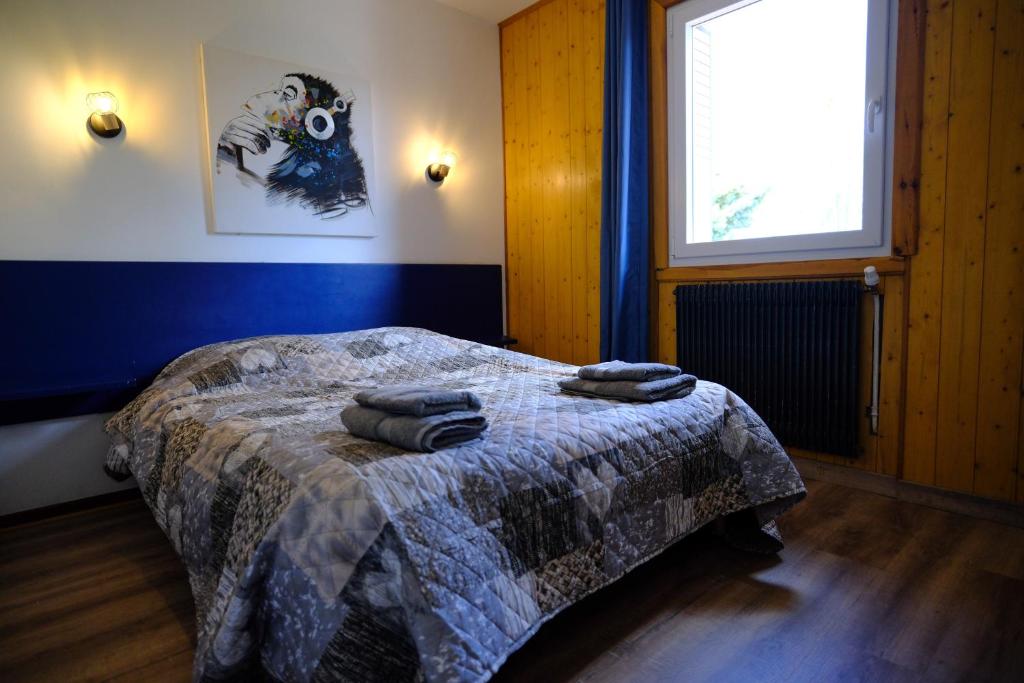 Postel nebo postele na pokoji v ubytování Auberge Des 3 Lacs