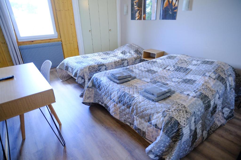 Postel nebo postele na pokoji v ubytování Auberge Des 3 Lacs