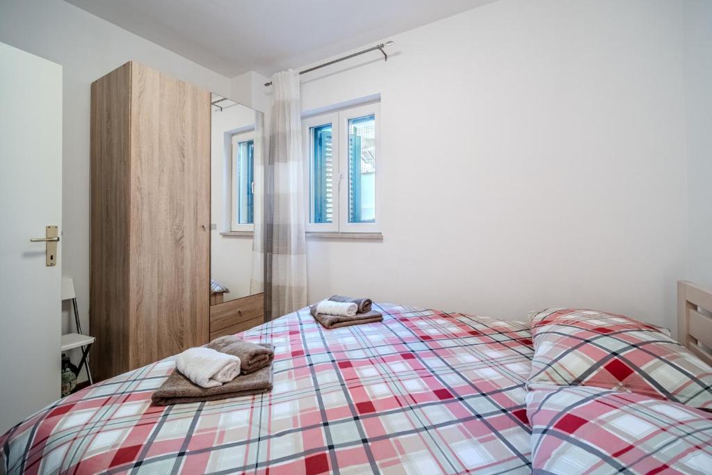 Posteľ alebo postele v izbe v ubytovaní Apartman Elephant