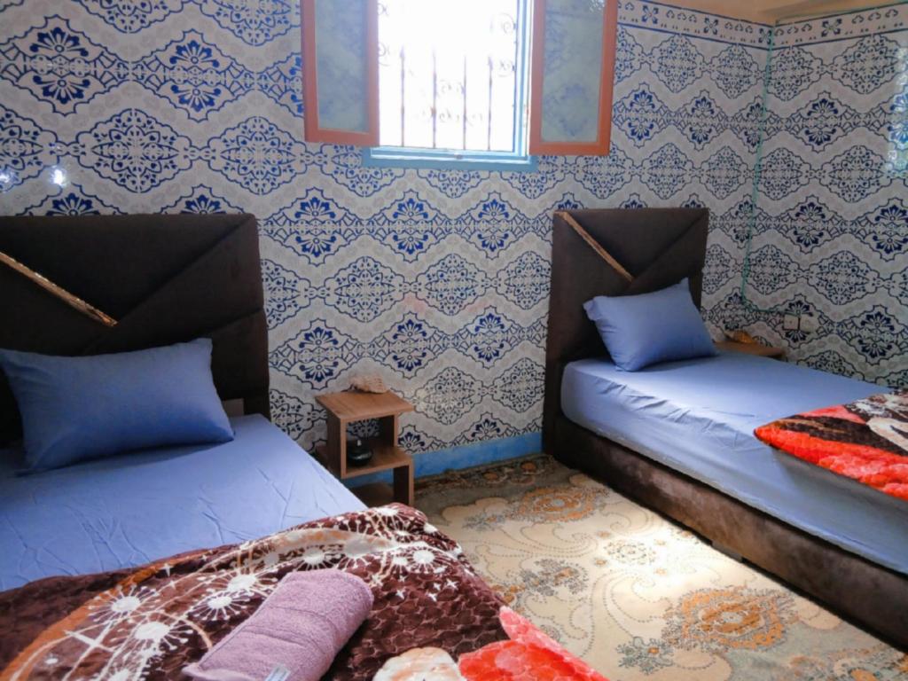 Postel nebo postele na pokoji v ubytování Tayrt Hostel
