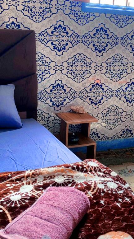 Postel nebo postele na pokoji v ubytování Tayrt Hostel