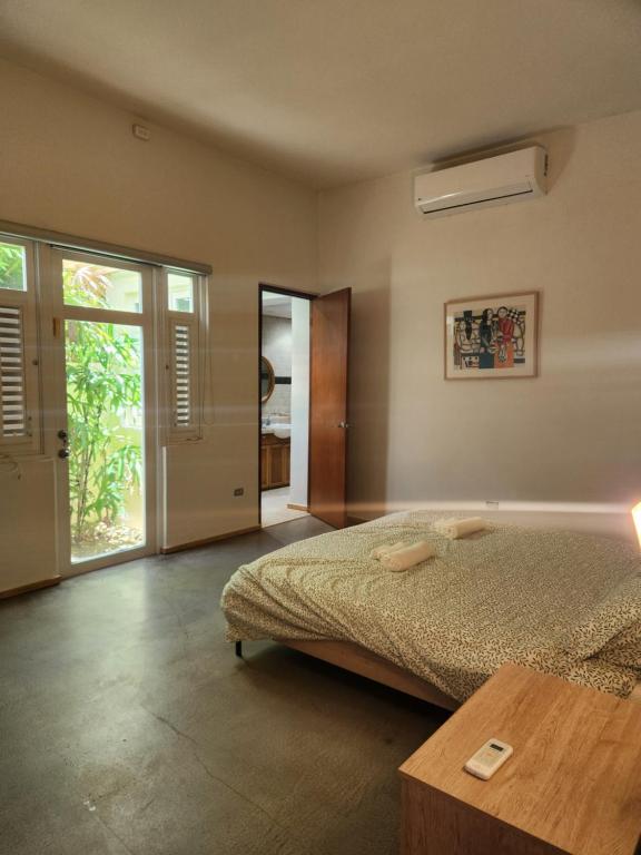 Una cama o camas en una habitación de Spain 2003