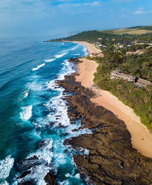 an aerial view of a beach and the ocean at Clansthal Bush Cottage in Clausthal