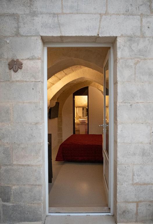 Postel nebo postele na pokoji v ubytování ENOTRIO caveoso