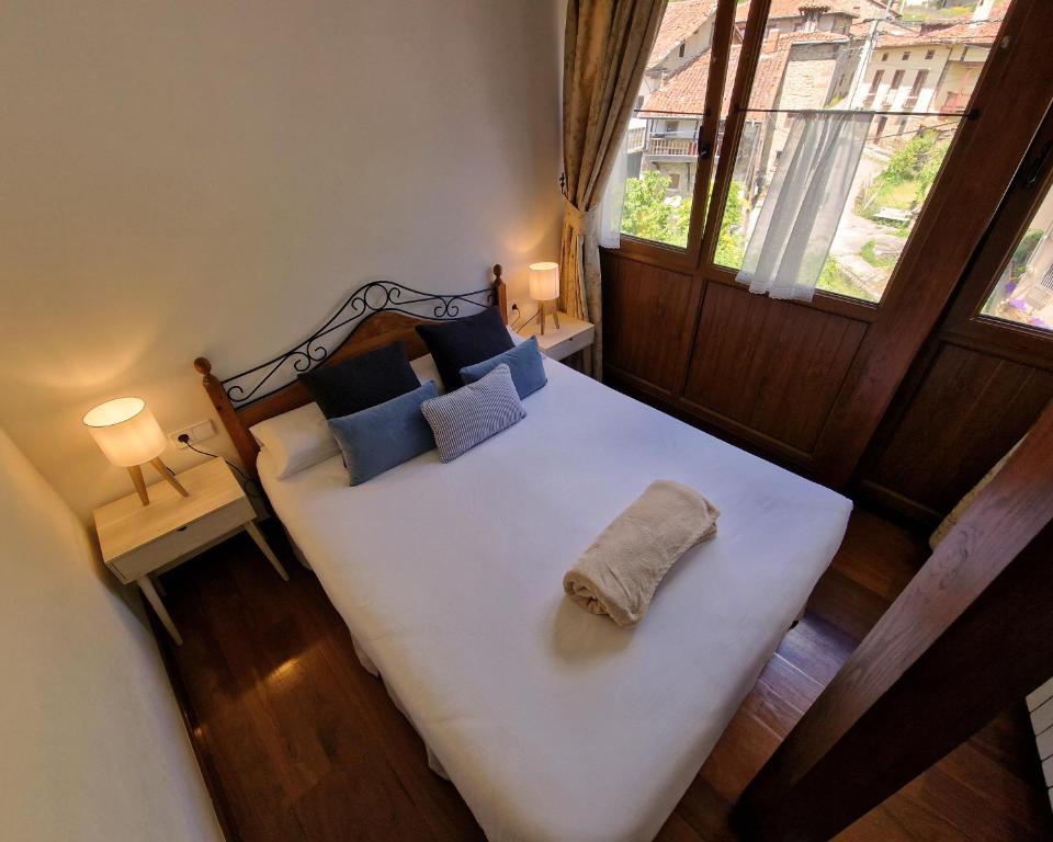 Postel nebo postele na pokoji v ubytování Apartamentos Remoña