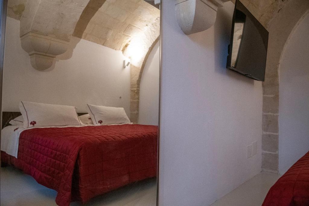Postel nebo postele na pokoji v ubytování ENOTRIO caveoso