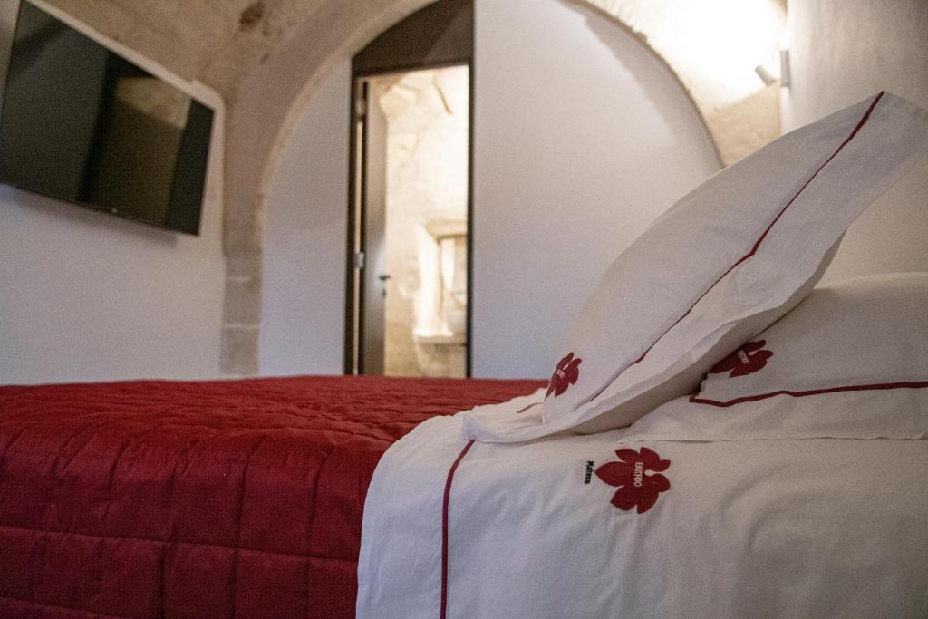 Postel nebo postele na pokoji v ubytování ENOTRIO caveoso