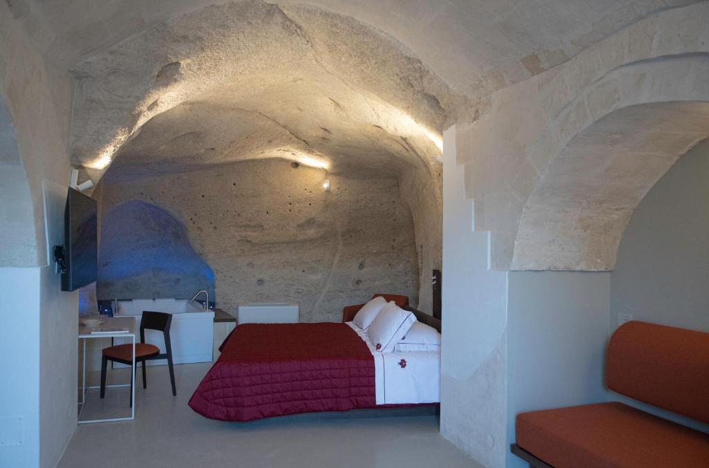 Postel nebo postele na pokoji v ubytování ENOTRIO caveoso