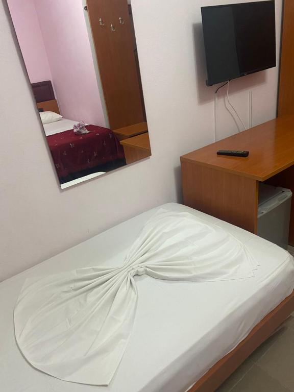 Postel nebo postele na pokoji v ubytování Hotel Edland