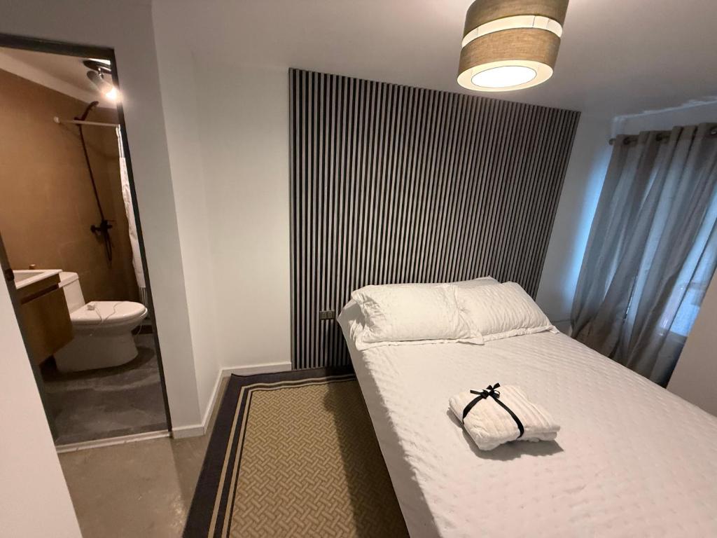 Postel nebo postele na pokoji v ubytování Hospedaje cómodo en El Rosario
