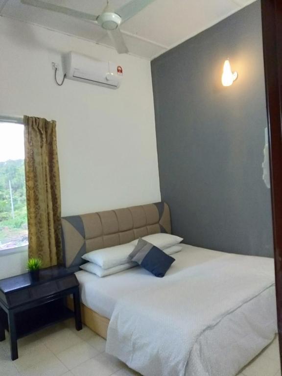 Postel nebo postele na pokoji v ubytování National Park Belebar Studio - Kuala Tahan