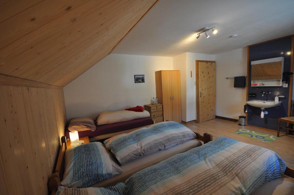 Postel nebo postele na pokoji v ubytování Gasthaus Waldheim
