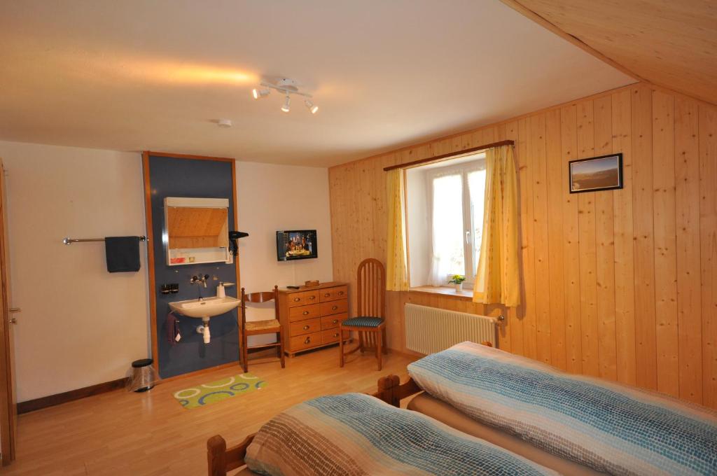 Postel nebo postele na pokoji v ubytování Gasthaus Waldheim