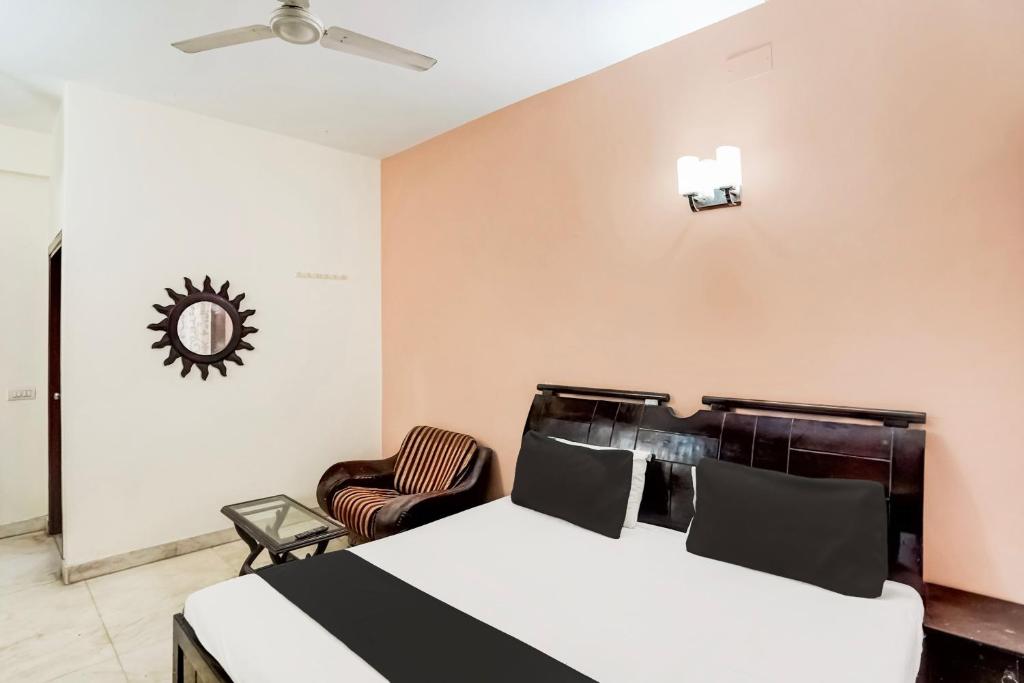 Postel nebo postele na pokoji v ubytování Hotel O Le Regent