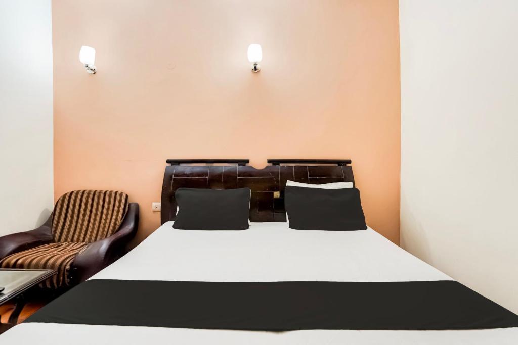 Postel nebo postele na pokoji v ubytování Hotel O Le Regent
