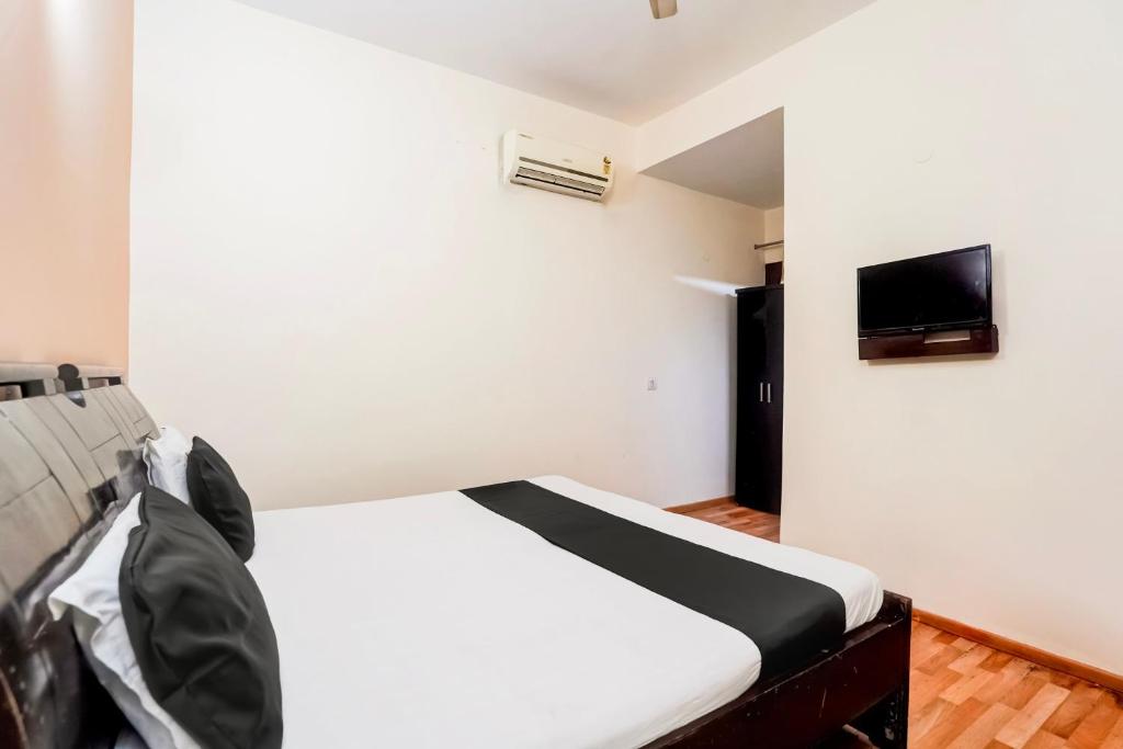 TV a/nebo společenská místnost v ubytování Hotel O Le Regent