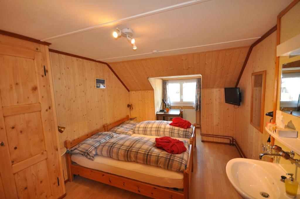 Postel nebo postele na pokoji v ubytování Gasthaus Waldheim