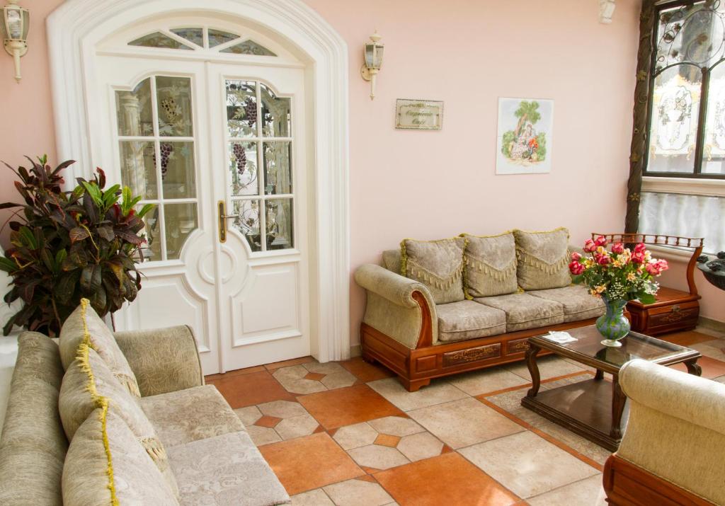Posezení v ubytování Eugenia Hotel