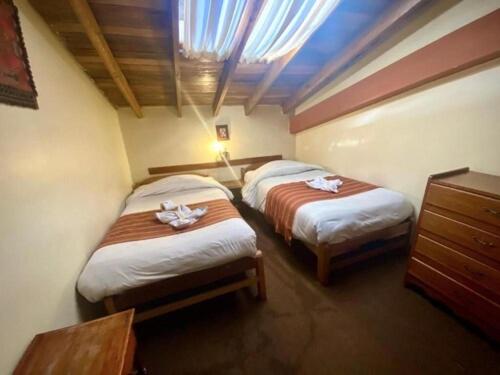 Postel nebo postele na pokoji v ubytování Andean Dreams 1