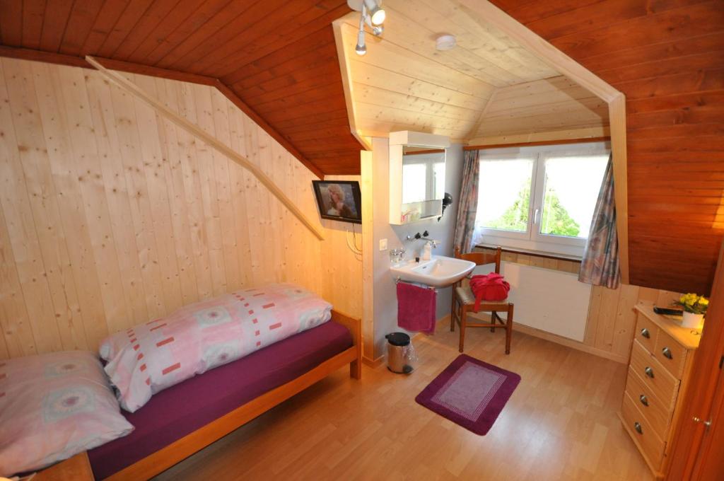 Postel nebo postele na pokoji v ubytování Gasthaus Waldheim