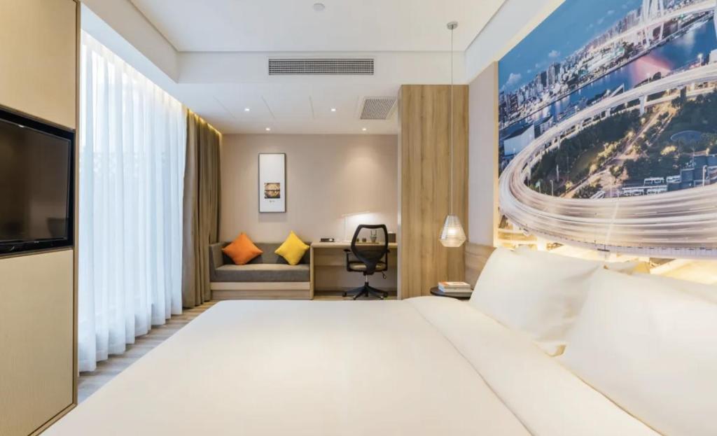 Postel nebo postele na pokoji v ubytování Atour Hotel Shanghai The Old Bund Pier