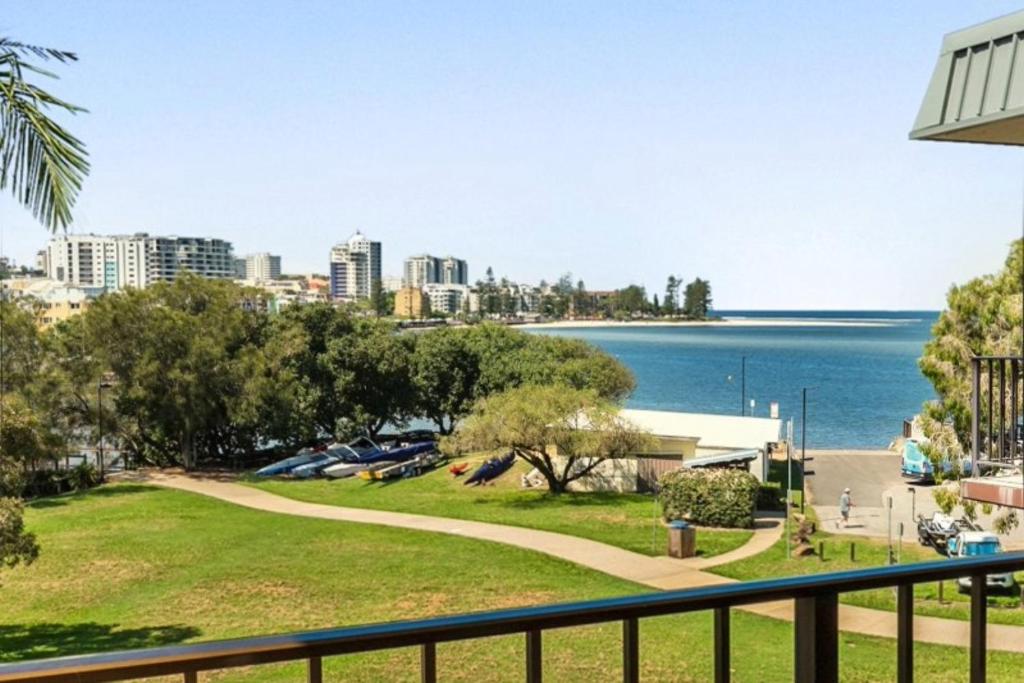 a view of the water from the balcony of a house at Kabi Apartment Caloundra - Self Contained in Golden Beach